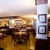 Mansouri Mansions Hotel in Manama dining room with set tables and warm lighting