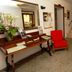 Albergo Umbria lobby in Città di Castello with reception desk, red chair, mirror and staircase