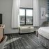 TownePlace Suites by Marriott Savannah Airport guest room with bed, window view and armchair in Savannah