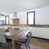 Hôtel confidentiel Le Grecale in Pianottoli-Caldarello kitchen with rustic dining table and modern cabinets