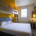 Hôtel ibis budget Fontainebleau Avon compact room with bunk bed, double bed and window