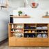 Dye House Providence boutique-style room with wooden shelving, folded linens and hanging clothes