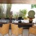 Asya Premier Suites in Boracay lobby lounge with woven chairs and a long wooden table amid bamboo and plants