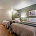 HomeTowne Studios by Red Roof Denver - Lakewood West room with two beds and kitchenette