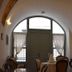 Vecchio Hotel in Rethymno lounge with arched window, sheer curtains, and classic seating