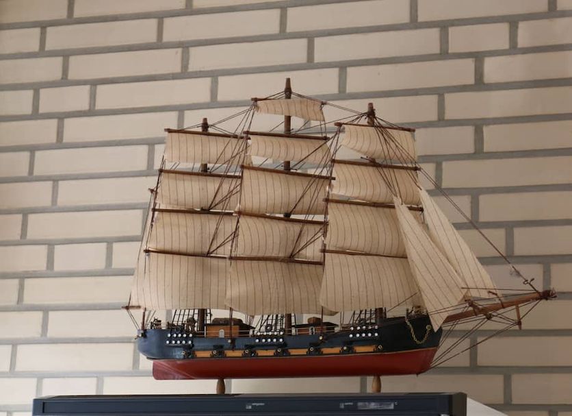Elbbrücken Hotel Hamburg lobby display of a detailed sailing ship model against a brick wall