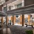 Catalonia Grand Costa Mujeres All Suites & Spa in Punta Sam: hotel courtyard with open-air seating and retail area