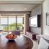 Hideaway at Royalton Negril suite with balcony, ocean view, round table, and sitting area