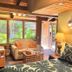 Maui What a Wonderful World Bed & Breakfast in Kīhei, cozy guest room with wicker sofa and garden view