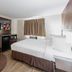 Red Roof Inn Bristol guest room with bed, TV, mini fridge and microwave in Bristol
