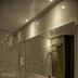 Onomo Hotel Rabat Terminus bathroom with glass shower, sink, and wall mirror in Rabat