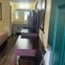 Somatel Goodlettsville guest room with king bed, desk, TV, and bathroom vanity visible