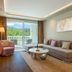 Amara Dolce Vita Luxury suite in Tekirova with balcony, mountain view, sofa, chair and coffee table