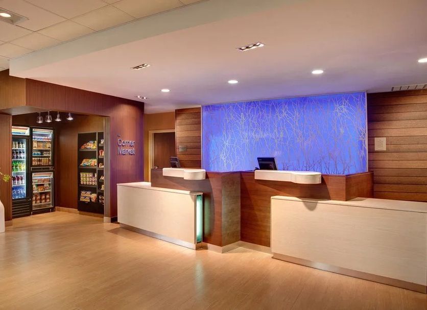 Fairfield Inn & Suites by Marriott Calhoun lobby with front desk and market area