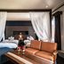 The Beach Terrace Hotel Ao Ishigaki guest room with twin beds, draped curtains, and seating area