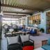 Akra V Hotel Antalya open-air lounge with cushioned seating and glass doors