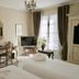 Le Manoir de Gressy in Gressy guest room with twin beds, TV, desk, and window with drapes