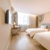 Home Inn Dalian Jinzhou Railway Station Stadium in Dalian: twin guest room with window and desk