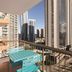 Vibe Hotel Gold Coast balcony with turquoise chair and city skyline view in Surfers Paradise