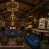 AC Hotels by Marriott Los Downtown Los Angeles lounge with blue velvet sofas, ornate chandelier and stained glass