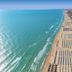 Hotel Villa Elena in Tortoreto with aerial view of sandy beach and turquoise sea beside the coast