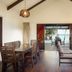 First Landing Beach Resort and Villas in Viseisei: villa interior with dining area opening to ocean-view deck