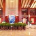 Sanqingshan Jinshawan Holiday Hotel Shangrao lobby with large blue-and-white vase fountain and plants