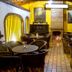Huerta Real Mazamitla in Mazamitla, cozy rustic lounge with fireplace and round dining tables