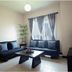 Home Edge Accommodations @ Tivoli Garden Residences Manila living room with sofas, coffee table and TV