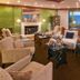 Le Manoir Au Lac in Gérardmer lounge with fireplace, armchairs and lake views through large windows