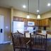Wyndham Vacation Resorts Steamboat Springs kitchen with island, barstools and pendant lights