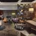 The Emblem Hotel Prague lounge with modern seating, glass tables and patterned tile walls