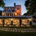 Park Hotel Villa Maria in Vico del Gargano with lit outdoor terrace and historic villa facade at dusk