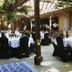 Ridgemark Golf Club And Resort in Hollister: elegant outdoor dining area with black-covered chairs and white tablecloths