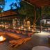 Lion Sands River Lodge in Sabie Park: outdoor fire pit lounge and candlelit deck at dusk