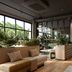 Hotel Schani Uno City Vienna lobby with seating, indoor plants, and large windows