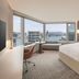 JW Marriott Hotel Hong Kong room with large corner windows and city skyline views in Hong Kong