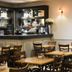 Tongadale Hotel in Portree breakfast room with wooden tables, chairs, and serving counter