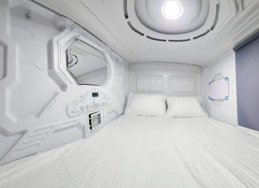 Aria Hotel Chisinau in Chisinau, futuristic white capsule-style guest room with twin bed