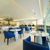 Nova M Olaya Hotel Edge By Rotana in Riyadh, modern lounge with blue chairs and glass wall city view