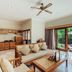 Desa Swan Villas & Spa, Keramas: villa living room with kitchenette and sliding doors to a garden patio
