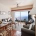 Albatroz Beach & Yacht Club Santa Cruz suite with ocean-view balcony, living area, and bedroom