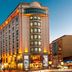 Ramada Plaza by Wyndham Istanbul City Center exterior in Istanbul with illuminated facade at dusk