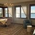 Oasis Lagoon Estate in Venice: waterfront lounge with large windows overlooking the lagoon