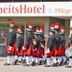 Marching band passes Gesundheitshotel Das Bad Peterstal in Bad Peterstal-Griesbach