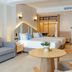 Khaolak Emerald Beach Resort & Spa in Phangnga suite with two beds, sofa, and seating area