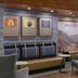 Holiday Inn Express & Suites Montrose - Black Canyon Area lobby seating with mountain mural and artwork