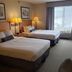 Wingate by Wyndham Coon Rapids guest room with two queen beds and window seating in Coon Rapids