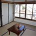 Minshuku Hayashi in Kamogawa with tatami room, low table, and large window view
