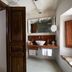 Hotel del Teatre in Regencós: rustic suite with bedroom and bathroom vanity with vessel sink